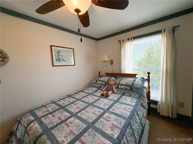 carpeted bedroom featuring ceiling fan