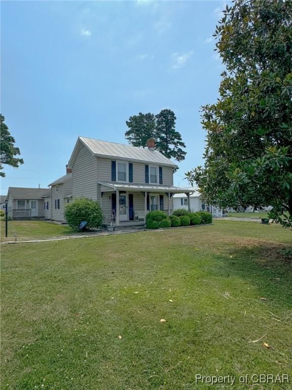 view of front of home featuring a front lawn and a porch