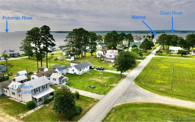 birds eye view of property featuring a water view