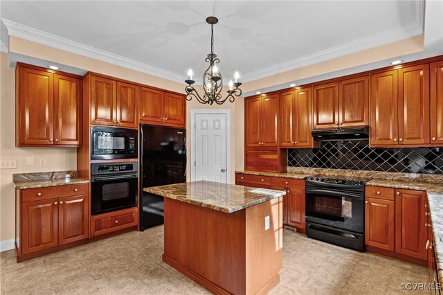 kitchen featuring pendant lighting, black appliances, a center island, an inviting chandelier, and crown molding