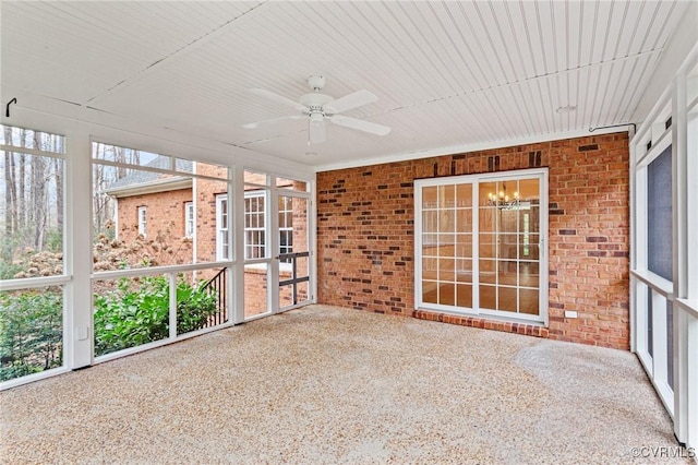 unfurnished sunroom with ceiling fan and a healthy amount of sunlight