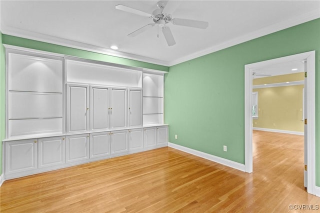 unfurnished bedroom with ceiling fan, ornamental molding, a closet, and light hardwood / wood-style floors