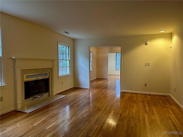 unfurnished living room with hardwood / wood-style floors