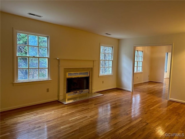 unfurnished living room with hardwood / wood-style flooring