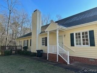 rear view of property featuring a yard