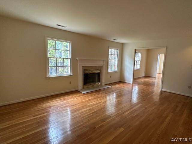 unfurnished living room with hardwood / wood-style floors