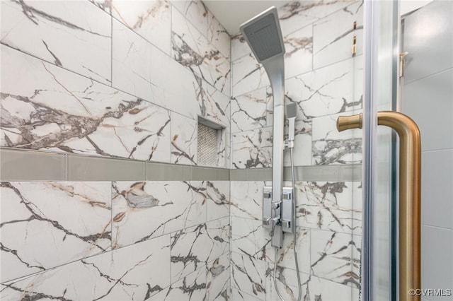 bathroom with tiled shower