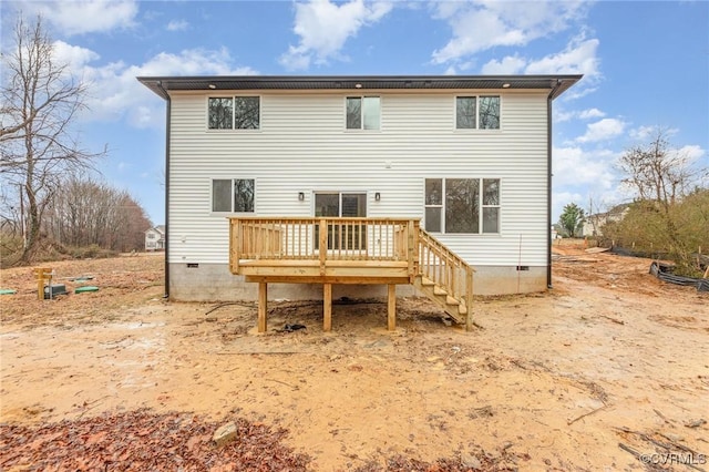 back of property with a wooden deck and crawl space
