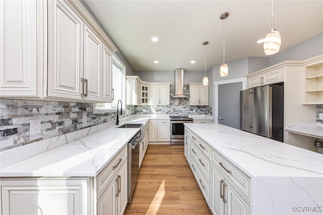 kitchen featuring open shelves, a sink, stainless steel appliances, wall chimney exhaust hood, and a kitchen island