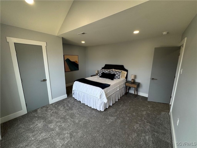 carpeted bedroom featuring recessed lighting, vaulted ceiling, visible vents, and baseboards