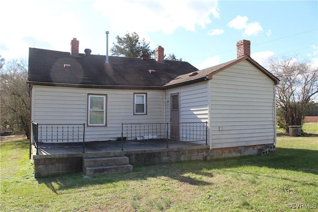 back of house with a yard