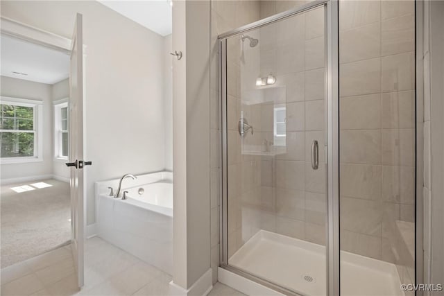 8355 Patrick Henry Blvd, Mechanicsville, VA 23116 - full bathroom featuring a bath, a shower stall, baseboards, and tile patterned flooring
