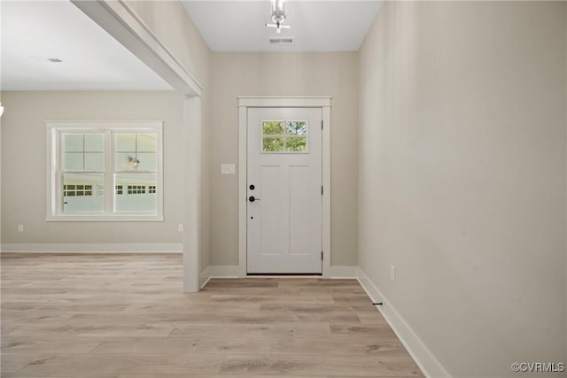 entrance foyer featuring light wood-type flooring, visible vents, and baseboards