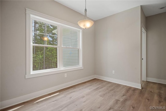 8355 Patrick Henry Blvd, Mechanicsville, VA 23116 - unfurnished dining area featuring baseboards and light wood-style flooring