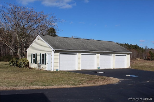 garage with a lawn