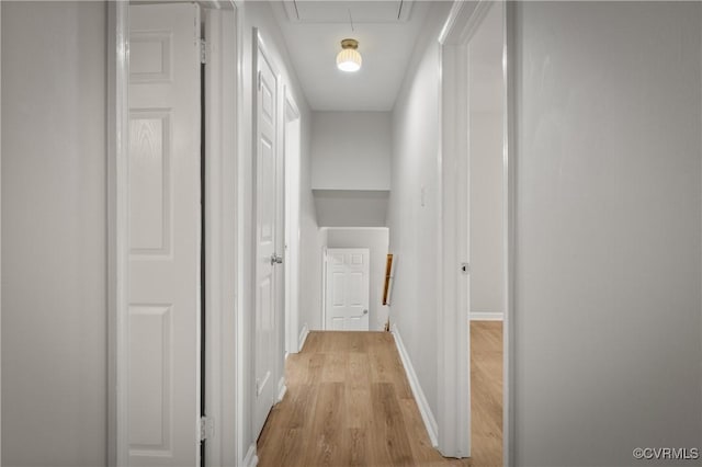 corridor with light wood-type flooring