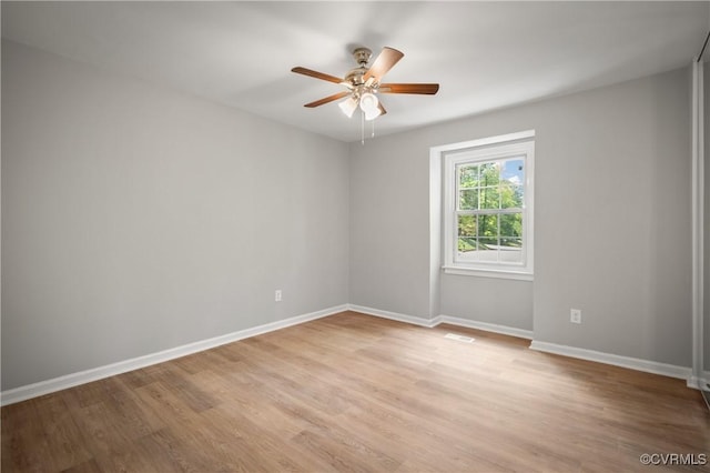 spare room featuring ceiling fan and light hardwood / wood-style floors