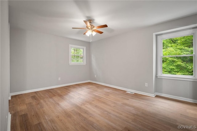 unfurnished room featuring ceiling fan and light hardwood / wood-style flooring