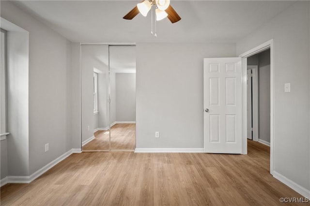 unfurnished bedroom with ceiling fan, light hardwood / wood-style floors, and a closet