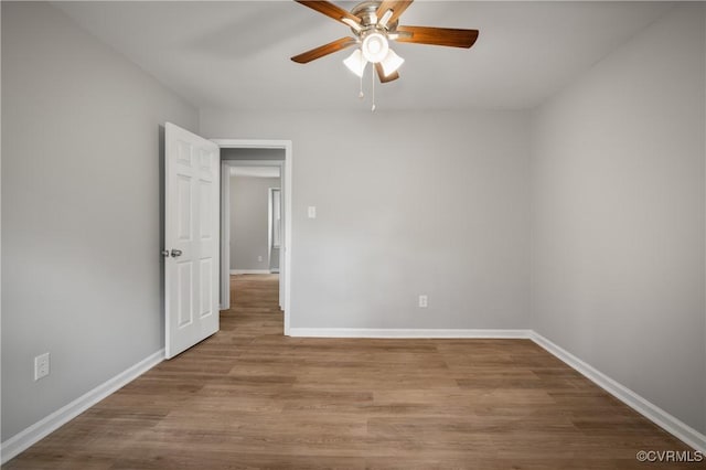 spare room with ceiling fan and light hardwood / wood-style flooring