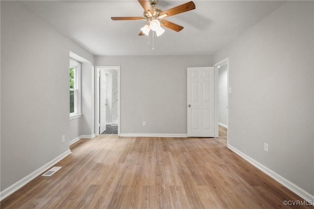 spare room featuring ceiling fan and light hardwood / wood-style flooring