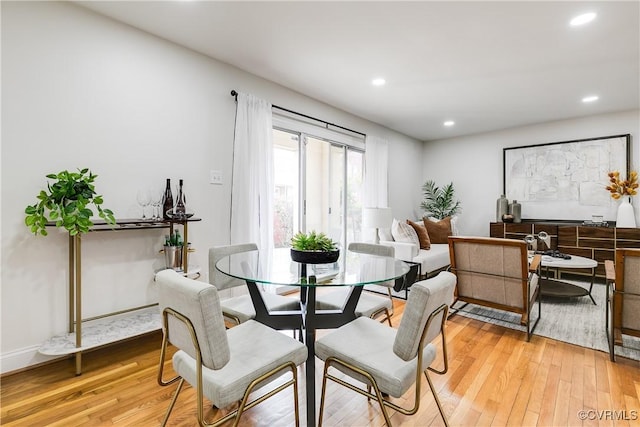 dining area with light hardwood / wood-style floors