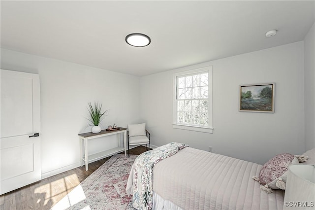 bedroom with hardwood / wood-style floors