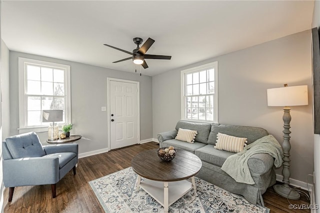 living room featuring ceiling fan, dark hardwood / wood-style flooring, and a wealth of natural light