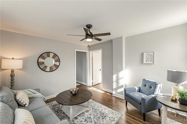 living room featuring ceiling fan and wood-type flooring