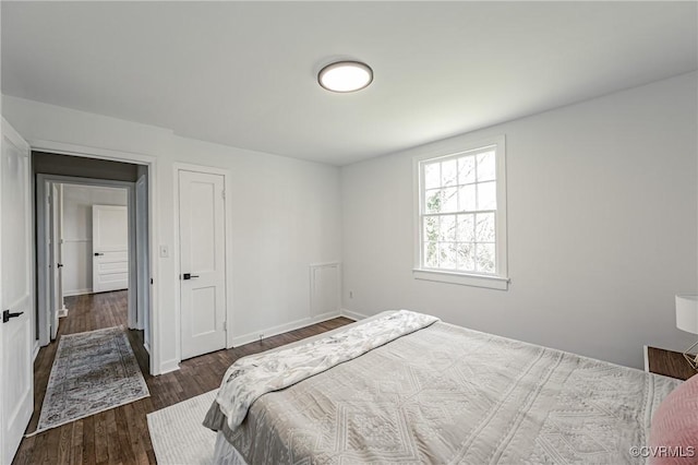 bedroom featuring dark wood-type flooring