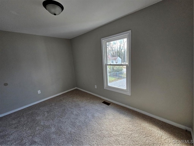 empty room featuring carpet flooring