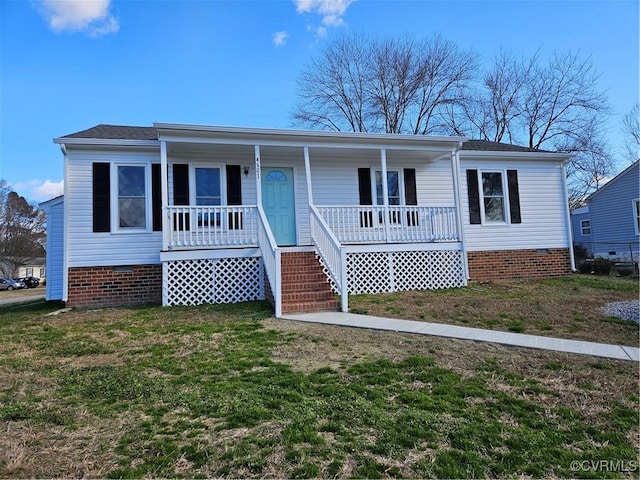 view of front of home featuring covered porch and a front lawn