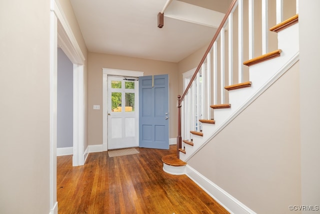 entryway with hardwood / wood-style floors