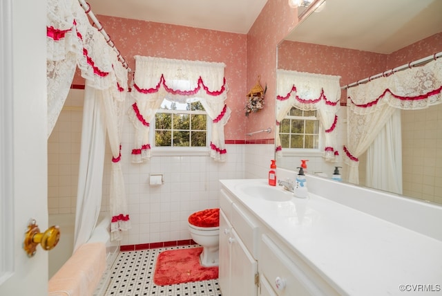 full bathroom featuring toilet, vanity, and shower / bath combo