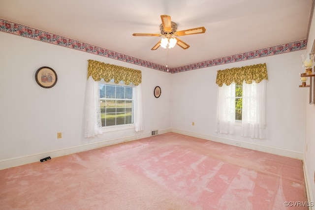 carpeted empty room with ceiling fan