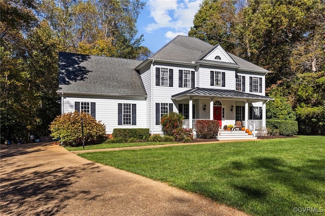 view of front of house with a porch and a front yard