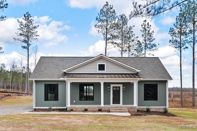 view of front of house with a front lawn and a porch