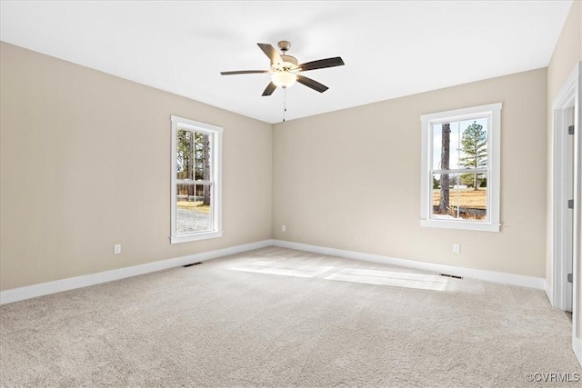 empty room with light carpet and ceiling fan