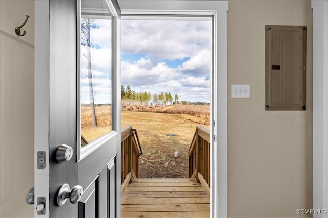 entryway with a rural view, electric panel, and hardwood / wood-style floors