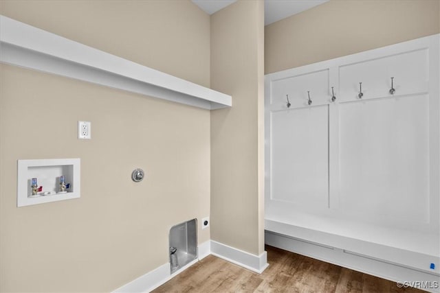 washroom with hardwood / wood-style floors, hookup for a washing machine, and electric dryer hookup