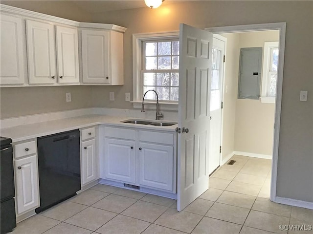 kitchen with sink, white cabinetry, light tile patterned floors, and dishwasher