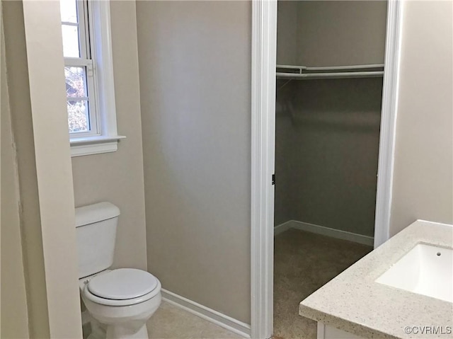 bathroom featuring toilet and vanity