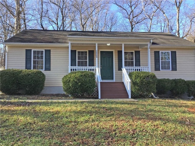 single story home with a front yard and covered porch