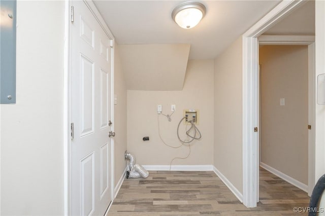 laundry room with light hardwood / wood-style floors and electric dryer hookup