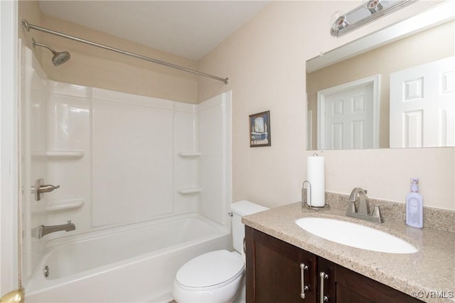 full bathroom with toilet, vanity, and shower / washtub combination