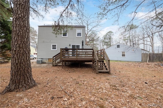 back of property featuring a wooden deck and central AC