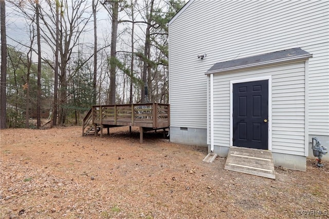 entrance to property with a deck