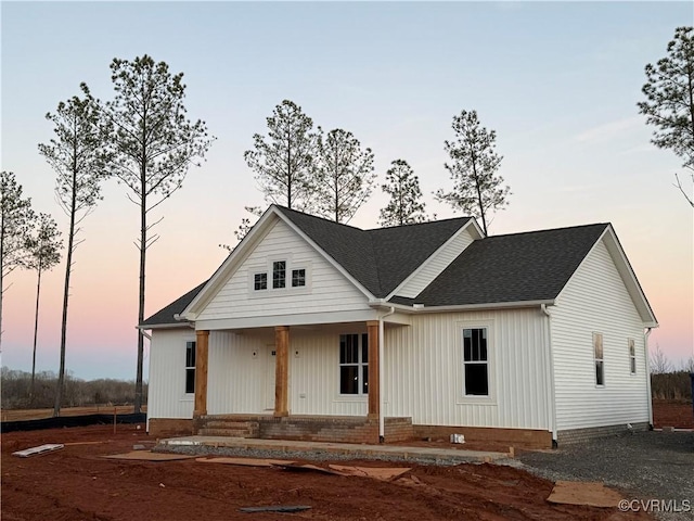 view of front of home featuring a porch, crawl space, and roof with shingles