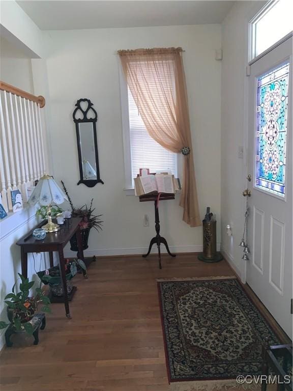 foyer entrance with hardwood / wood-style floors