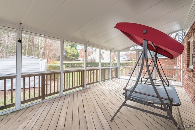 sunroom / solarium with vaulted ceiling